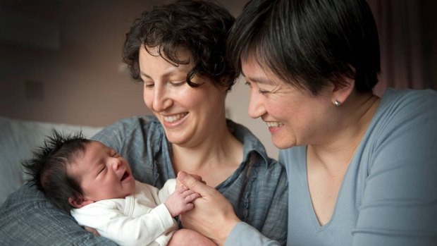 Penny Wong and partner Sophie Allouache after the birth of their daughter Alexandra in 2011. 