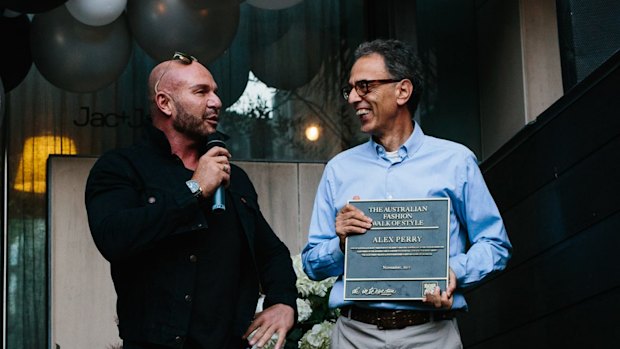 Theo Onisforou awarding Alex Perry with his plaque for his induction into the Australian Fashion Walk of Style.