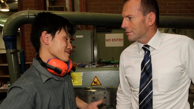  Then opposition leader Tony Abbott meeting Tuang Dong when he toured  Paragon Printing in 2011. 