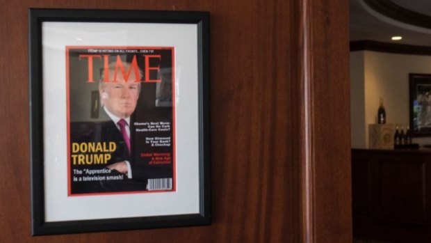 A fake edition of Time Magazine with Donald Trump on the cover hangs in a number of Trump properties.