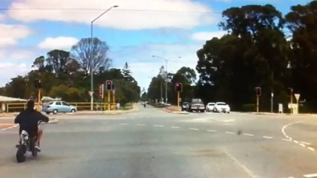 Just days after two motorbike fatalities on Pinjarra Road, dashcam footage has captured two riders running a red light at speed.