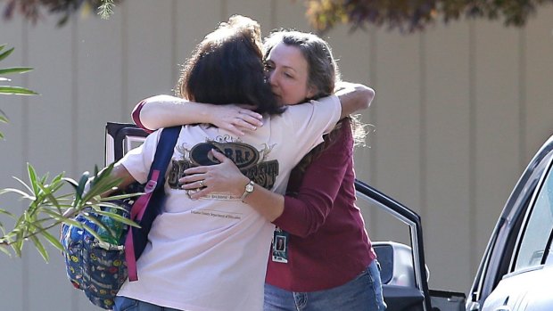 Two women embrace outside Rancho Tehama Elementary School, where a gunman opened fire on Tuesday.