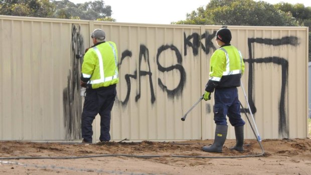 City of Mandurah workers were removing the offensive slogans on Friday morning.