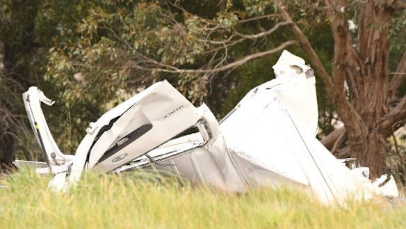 A woman died after a car crashed while being chased by police near on the Western Freeway.