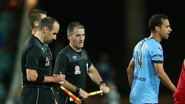 Sydney FC skipper Alex Brosque after an encounter with the referee.
