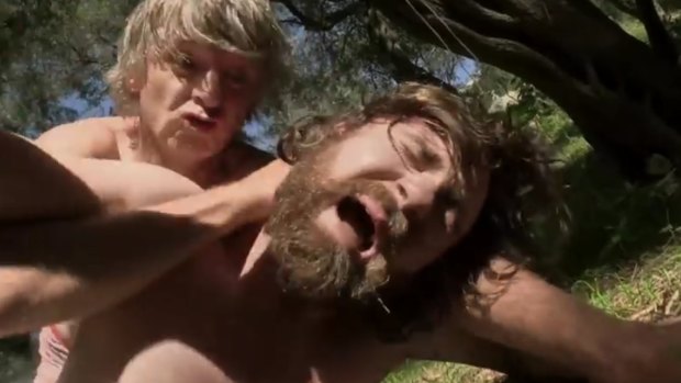Neil Finn temporarily gets the better of son Liam Finn in the video for 'Wrestle With Dad'.