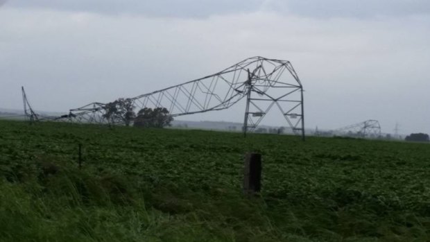 A transmission tower in South Australia is damaged following severe winds.