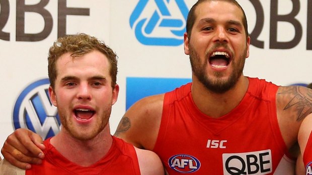 Tom Mitchell and Lance Franklin celebrate a Swans win.