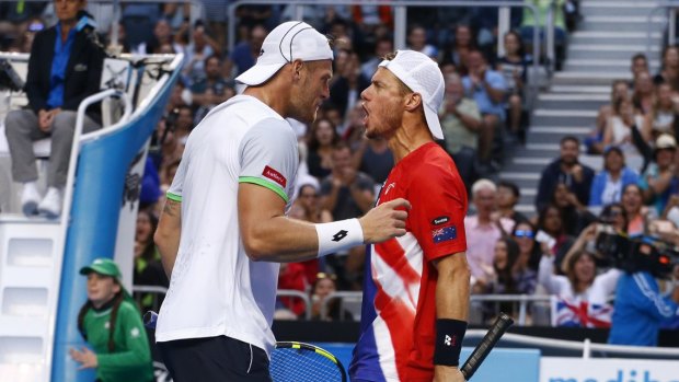 Pumped:  Sam Groth and Lleyton Hewitt celebrate after winning a point.