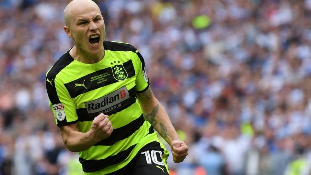 Clutch moment: Aaron Mooy of Huddersfield Town celebrates scoring during the penalty shootout.