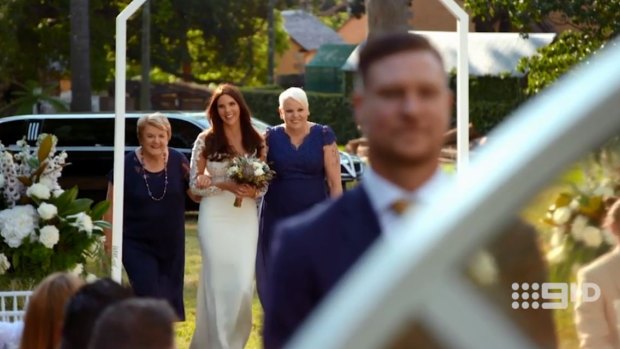 Tracey comes down the aisle with both her mothers on Married At First Sight.