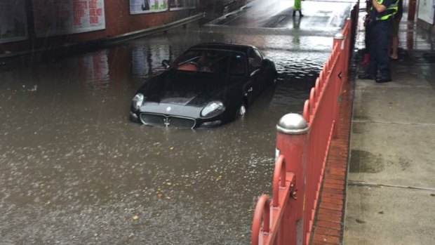 A Maserati stricken in floodwater on Victoria Street, Seddon.