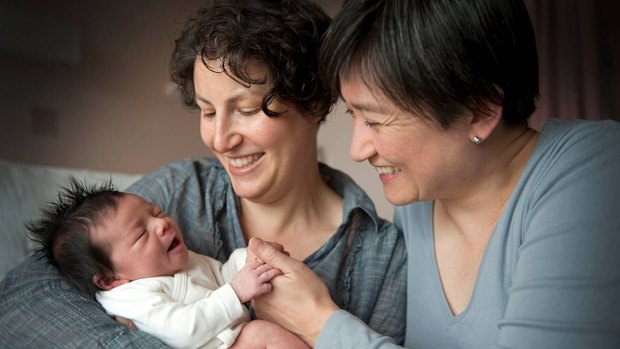 Penny Wong and partner Sophie Allouache after the birth of their daughter Alexandra in 2011. 