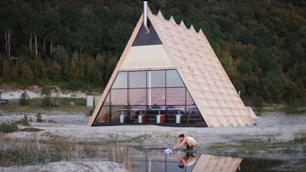 The pyramid-shaped sauna houses more than 100 people. 