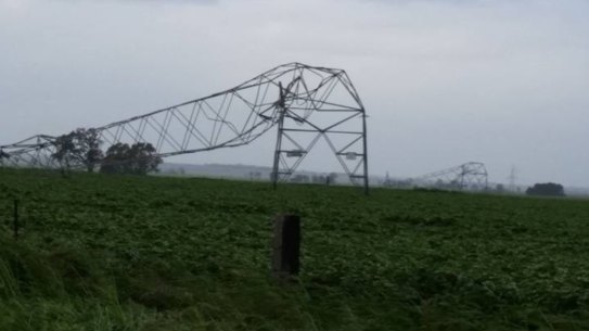 A transmission tower in South Australia is damaged following severe winds.