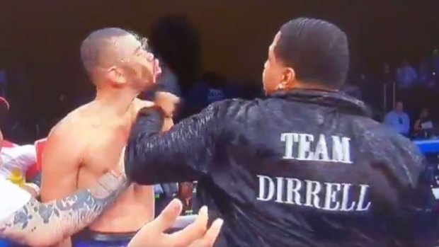 Out of nowhere: Andre Dirrell's trainer took matters into his own hands after his boxer's opponent was disqualified for shots after the bell.