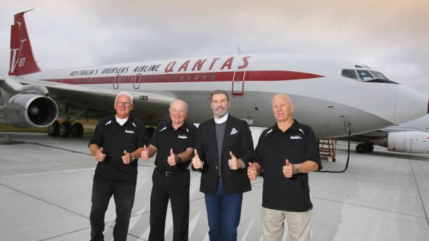 John Travolta officially hands over his Boeing 707 to HARS members Peter Elliott (left), John Dennis and Frank Bowden at Brunswick's Golden Isles Airport in Georgia USA on Sunday.