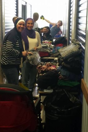 Volunteers sort through donated good at the storage centre.