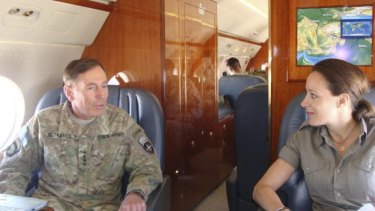 Paula Broadwell flies with General David Petraeus in Afghanistan in 2011. 