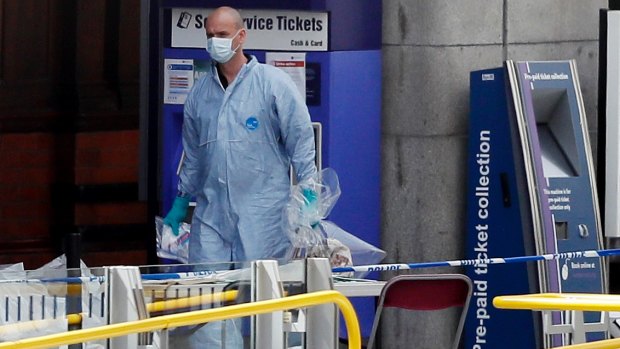 Forensic officers investigate the scene near the Manchester Arena.