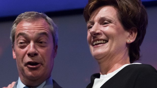 Outgoing UKIP leader Nigel Farage congratulates MEP Diane James after she was announced as the new leader of UKIP.