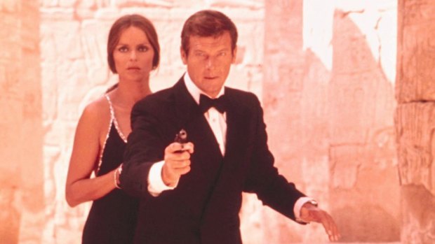 Moore with Barbara Bach as Anya Amasova in <i>The Spy Who Loved Me</i>. By 1977, he was firmly established as "the amusing Bond".