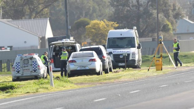 Investigators on scene along the Midland Highway, Huntly. The white car is not believed to be involved in the investigation. 