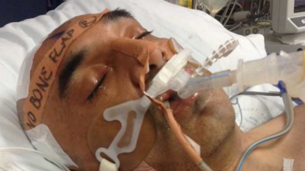 Fady Taiba in hospital recovering from brain surgery after a one-punch attack in 2013.