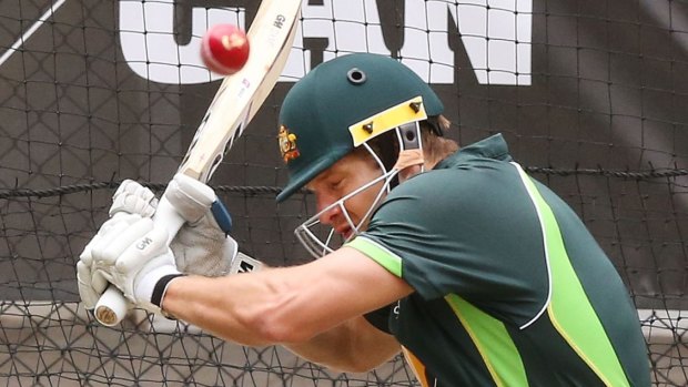 Getting back on the horse: Shane Watson fends off a bouncer in the nets in Adelaide on Sunday.