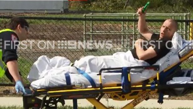 A man is transported in a stretcher after a crash in Epping on Sunday morning.