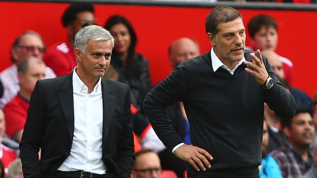 Manchester United manager Jose Mourinho, left, and West Ham United manager Slaven Bilic, during the opening round of the EPL season.