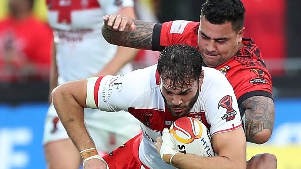 Pacific power: Andrew Fifita tackles Alex Walmsley at Mount Smart Stadium.