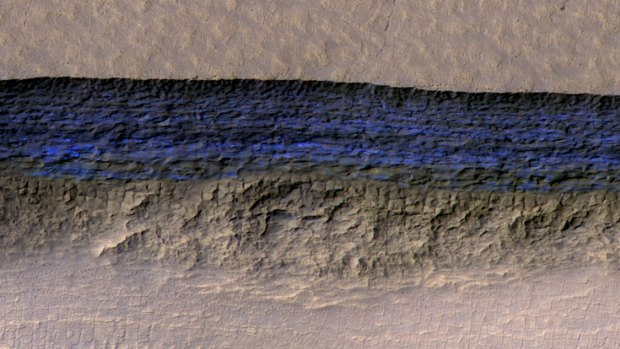 A thick sheet of ice on Mars, photographed by a NASA orbiter, appears bright blue in this enhanced-colour view.