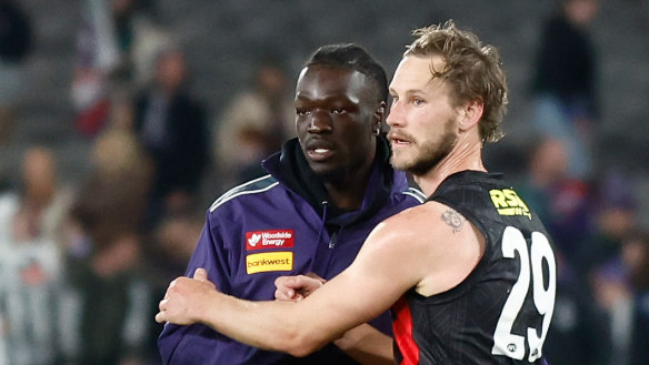 Michael Frederick of the Dockers and Jimmy Webster of the Saints shake hands post game.