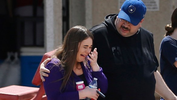 People arrive at MacArthur Elementary looking for family and friends. The school was being used as a reunification centre in the aftermath of the shooting.