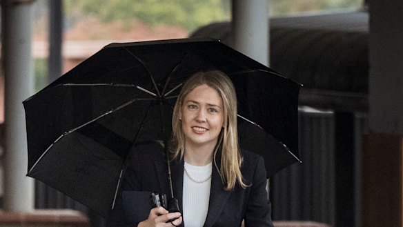 Now you see them … Amelia Hamer arrives at Caulfield Racecourse on Sunday for her preselection. 