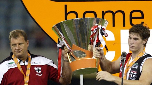 Grant Thomas lifts the 2004 Wizard Cup with Lenny Hayes.