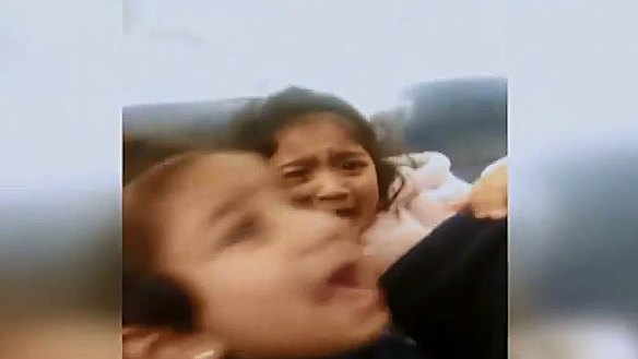 Kopika and Tharunicaa, aged four and two, on the charter plane to Darwin on Thursday night. 
