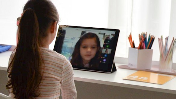 Evie Macheda, five, learns from home on the first day of term two.