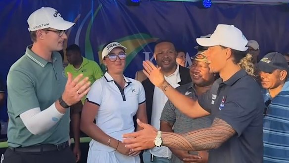 Jarome Luai greets the winner of the PNG Open, Josh Armstrong.