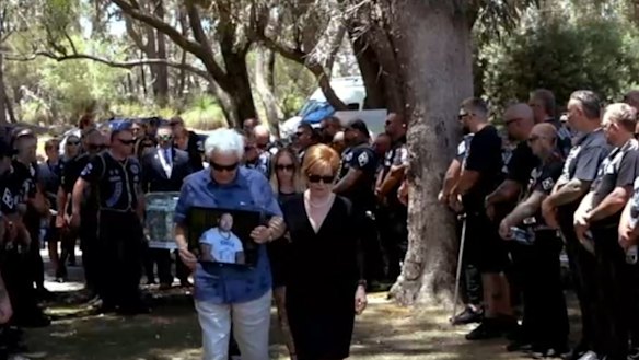 A photo of Nick Martin leads the start of the funeral.