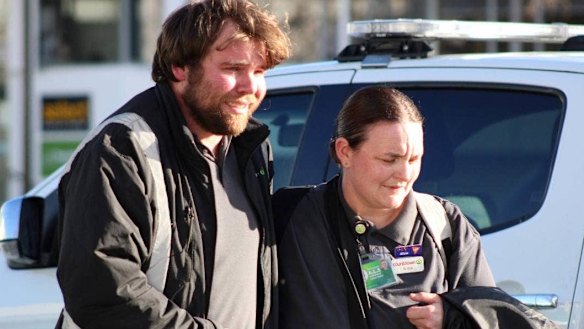 Workers make their way to safety after a suspected stabbing in Dunedin.