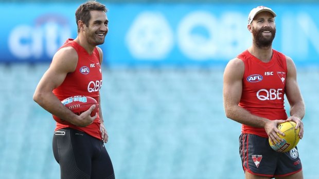 Veteran: Jarrad McVeigh (right) shares a laugh with captain Josh Kennedy.