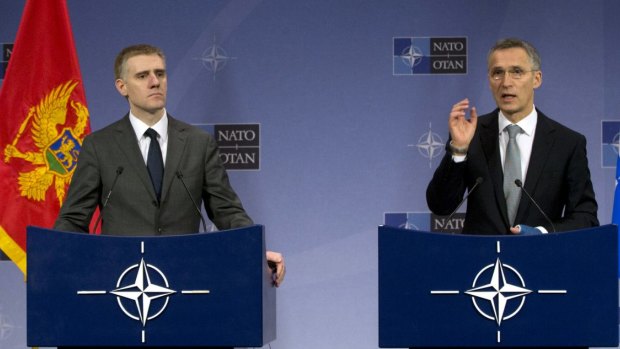 NATO Secretary-General Jens Stoltenberg (right) and Montenegro's Foreign Minister Igor Luksic in Brussels on Wednesday.