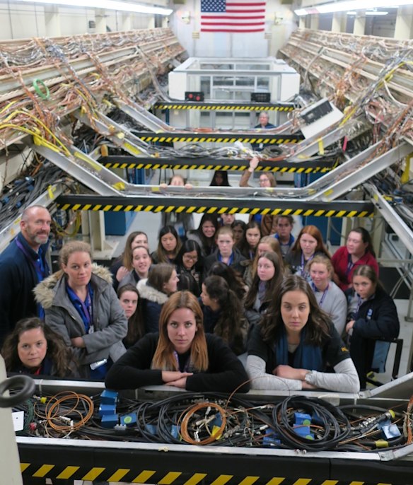 Female students from Australia inside the space shuttle at NASA's Houston Association for Space and Science Education.