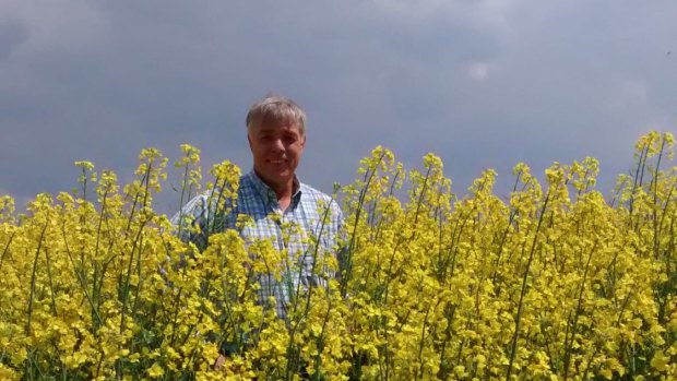 Ballarat man Lawrence Richmond standing in a Ukraine canola crop. 
