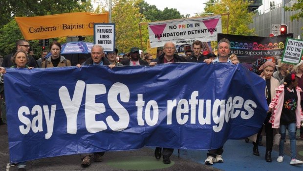 Church leaders and others take part in the pro-refugee rally on Palm Sunday.