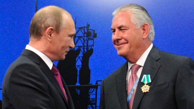 Russian President Vladimir Putin (left) presents ExxonMobil CEO Rex Tillerson with a Russian medal at an award ceremony in 2012.