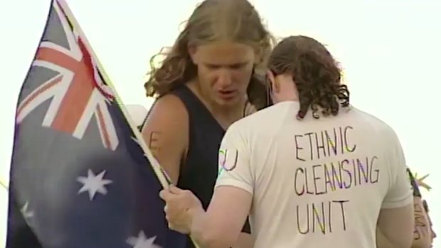 News footage at the opening of the black comedy <i>Down Under</i>.