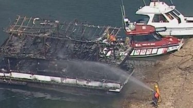 The charred remains of the house boat.